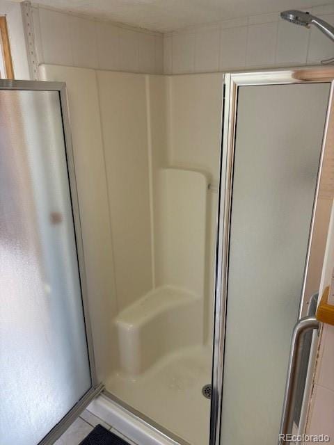 full bathroom featuring a stall shower