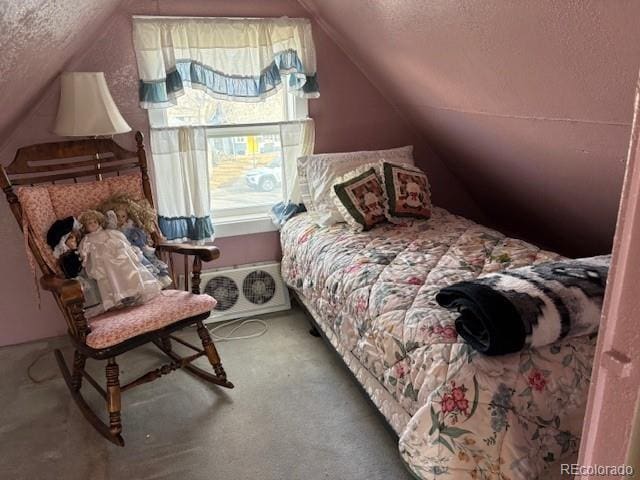 bedroom featuring carpet, vaulted ceiling, and a textured ceiling