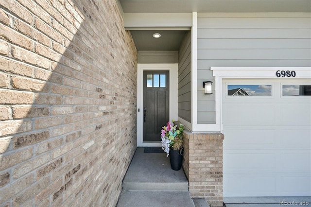6980 S Yantley Ct, Aurora, CO 80016 - property entrance featuring a garage