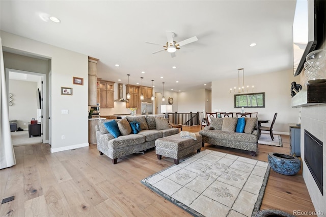 6980 S Yantley Ct, Aurora, CO 80016 - living area featuring a ceiling fan, light wood-style floors, a chandelier, and recessed lighting