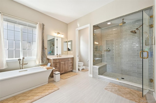 6980 S Yantley Ct, Aurora, CO 80016 - full bathroom with a shower stall, toilet, vanity, and a freestanding tub