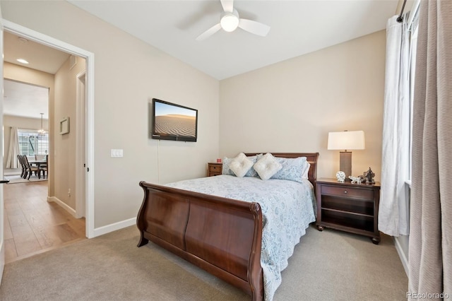 6980 S Yantley Ct, Aurora, CO 80016 - bedroom with baseboards, light carpet, and ceiling fan