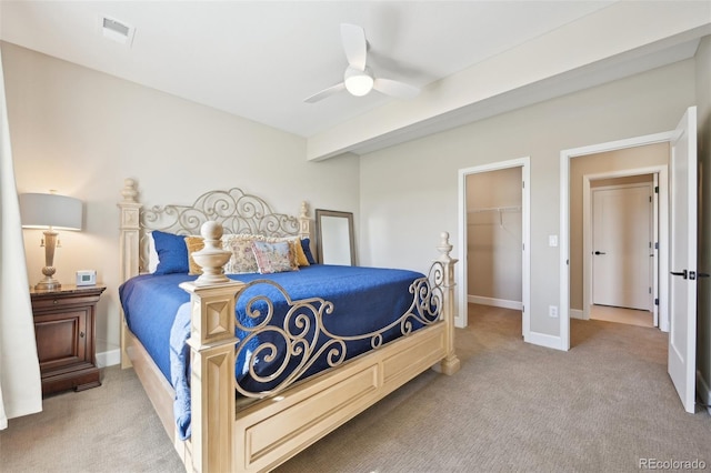 6980 S Yantley Ct, Aurora, CO 80016 - carpeted bedroom featuring a walk in closet, a closet, ceiling fan, and baseboards