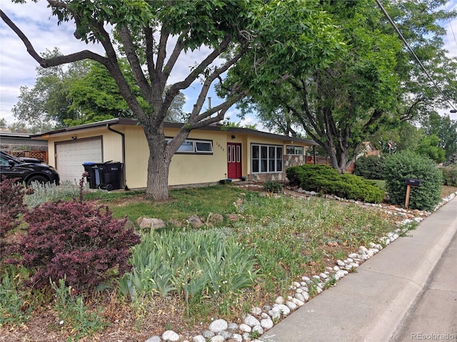 7409 Pierce St, Arvada, CO 80003 - ranch-style house featuring an attached garage