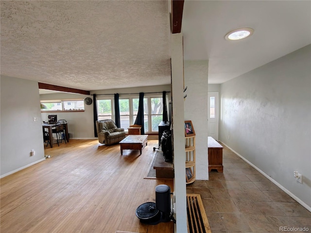 7409 Pierce St, Arvada, CO 80003 - living area featuring a textured ceiling