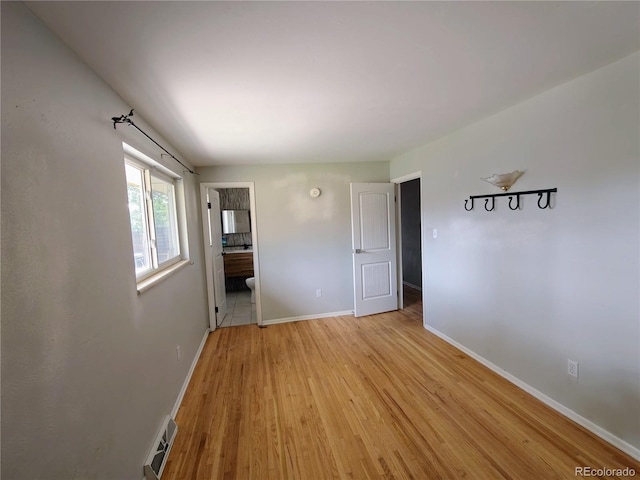 7409 Pierce St, Arvada, CO 80003 - spare room featuring light wood-type flooring and baseboards