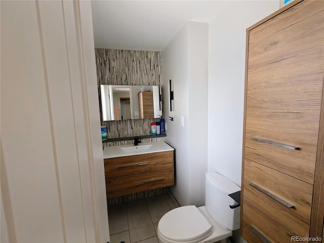 7409 Pierce St, Arvada, CO 80003 - bathroom with vanity, tile patterned floors, and backsplash