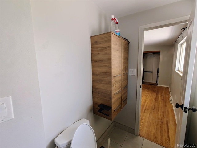 7409 Pierce St, Arvada, CO 80003 - bathroom featuring toilet and tile patterned flooring