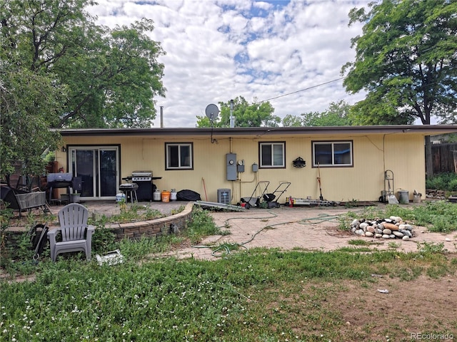 7409 Pierce St, Arvada, CO 80003 - rear view of house featuring a patio