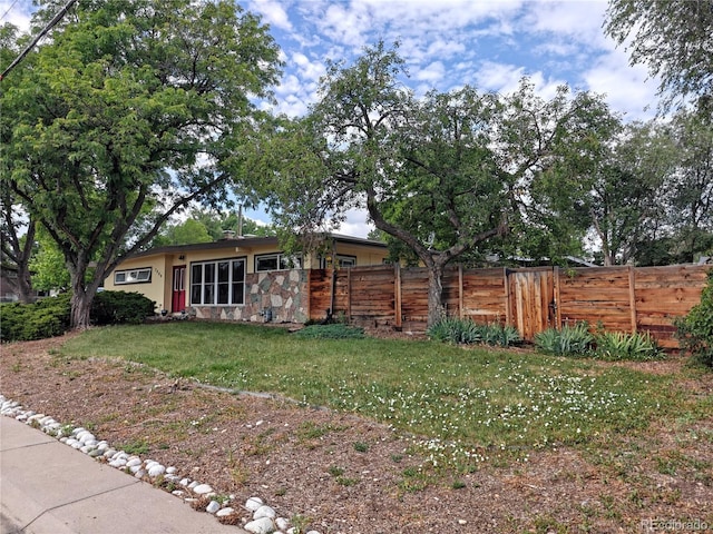 7409 Pierce St, Arvada, CO 80003 - view of front facade featuring stone siding