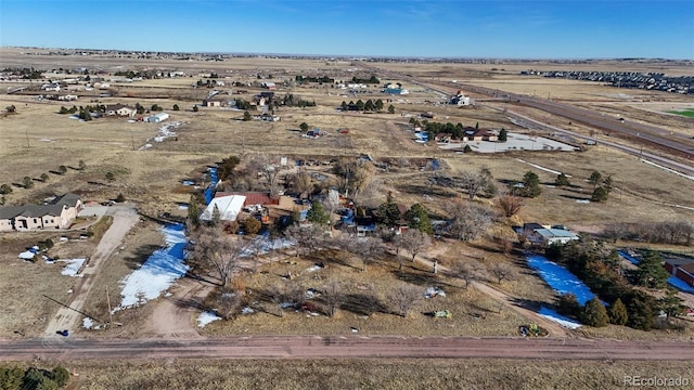 drone / aerial view featuring a rural view and a water view