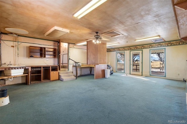 miscellaneous room with ceiling fan and carpet floors