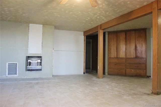 7615 Maverick Rd, Colorado Springs, CO 80908 - unfurnished living room with heating unit, tile patterned floors, and ceiling fan