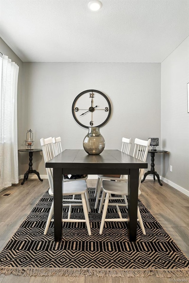 1670 Vantage Pkwy, Berthoud, CO 80513 - dining room with light wood finished floors and baseboards