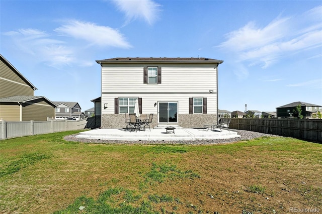 1670 Vantage Pkwy, Berthoud, CO 80513 - rear view of house with a fenced backyard and a patio