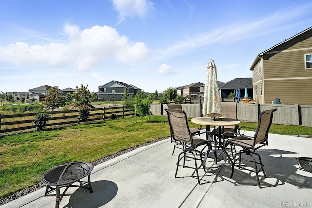1670 Vantage Pkwy, Berthoud, CO 80513 - fenced backyard featuring a patio, a residential view, and outdoor dining space