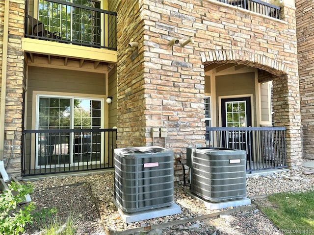 17346 Nature Walk Trl Unit 105, Parker, CO 80134 - exterior view of central AC unit, arched walkways, and brick siding