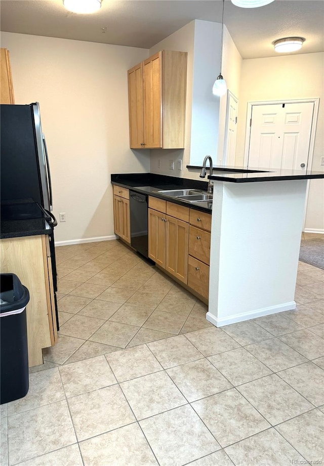 17346 Nature Walk Trl Unit 105, Parker, CO 80134 - kitchen featuring dishwasher, dark countertops, a sink, light tile patterned floors, and freestanding refrigerator