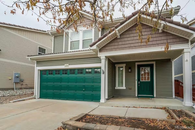 view of front of house with a garage and covered porch