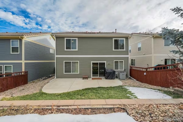 back of property featuring a patio and central AC unit