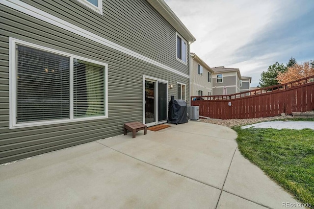 view of patio with central AC and a grill