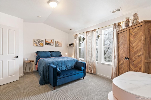 997 Burning Bush Pt, Monument, CO 80132 - bedroom with vaulted ceiling, light carpet, and baseboards