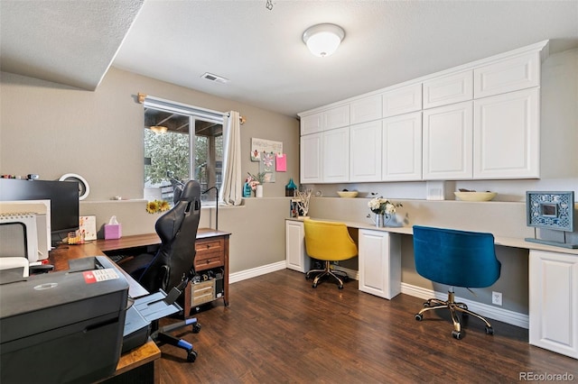 997 Burning Bush Pt, Monument, CO 80132 - home office featuring dark wood-style flooring, baseboards, and built in study area