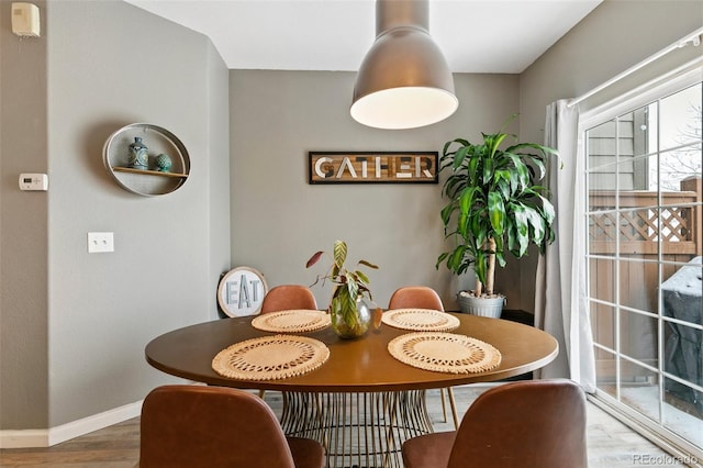 997 Burning Bush Pt, Monument, CO 80132 - dining room with wood finished floors and baseboards
