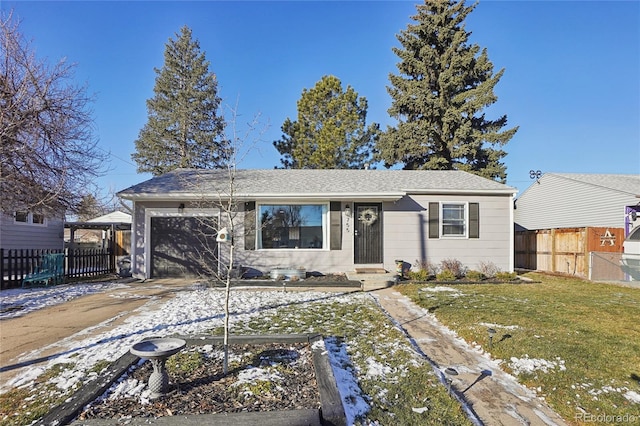 single story home with a garage and a yard