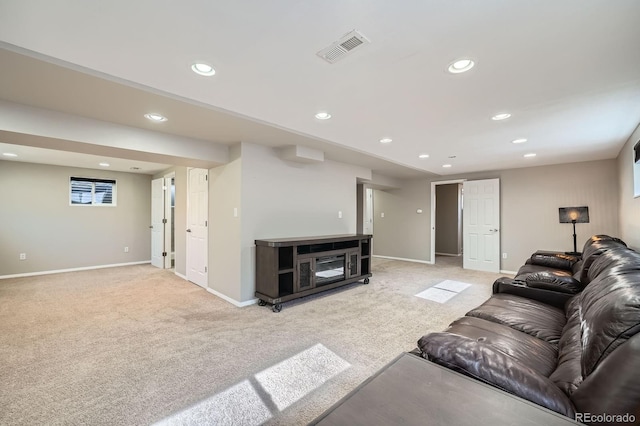 living room with light carpet, recessed lighting, visible vents, and baseboards