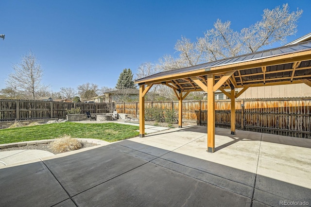 view of patio / terrace with a fenced backyard and a gazebo
