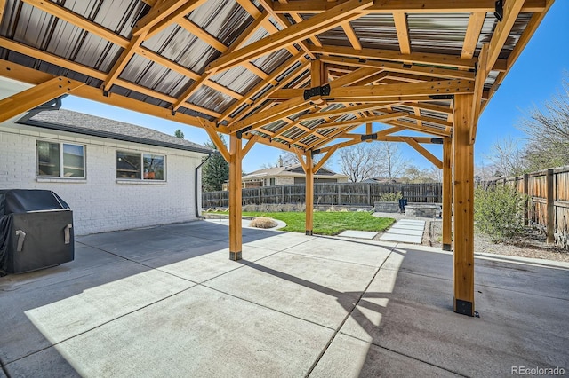 view of patio / terrace with grilling area and a fenced backyard