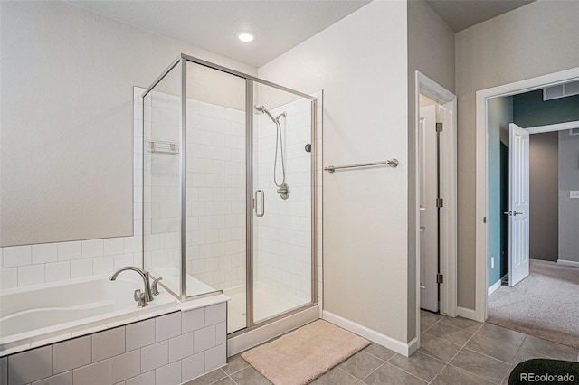 4532 Dewey Ln, Brighton, CO 80603 - full bath with a stall shower, a bath, tile patterned flooring, and baseboards