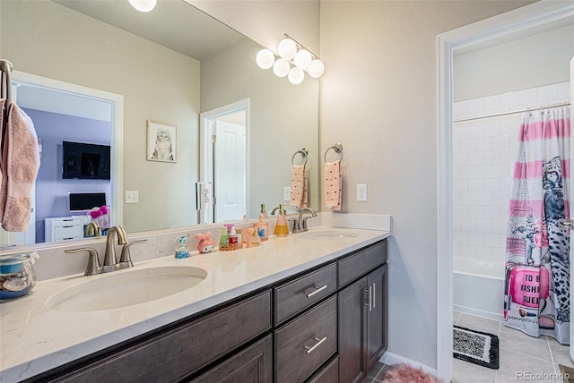 4532 Dewey Ln, Brighton, CO 80603 - full bathroom featuring double vanity, tile patterned floors, and shower / bath combination with curtain