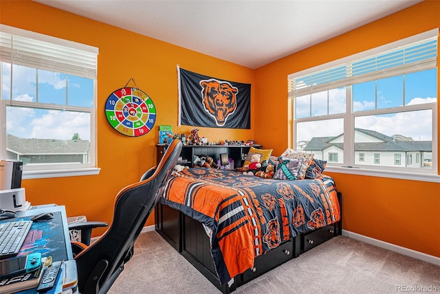 4532 Dewey Ln, Brighton, CO 80603 - bedroom with multiple windows, carpet floors, baseboards, and an office area