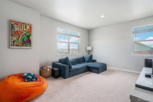 4532 Dewey Ln, Brighton, CO 80603 - carpeted living area featuring plenty of natural light, baseboards, and recessed lighting