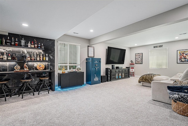 4532 Dewey Ln, Brighton, CO 80603 - living room with carpet flooring, a bar, and recessed lighting