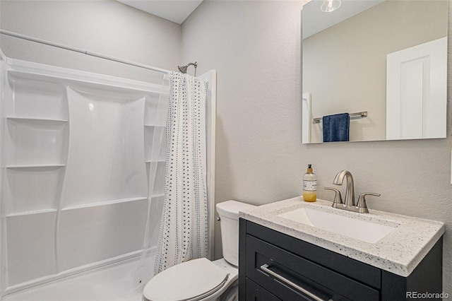 4532 Dewey Ln, Brighton, CO 80603 - full bathroom featuring toilet, vanity, a textured wall, and shower / tub combo