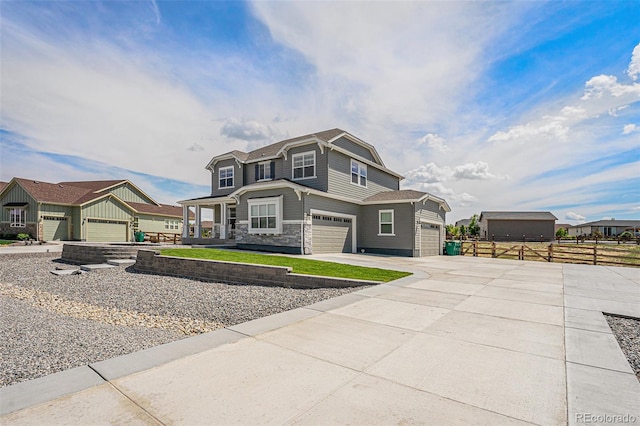 4532 Dewey Ln, Brighton, CO 80603 - view of front of property with driveway, stone siding, and an attached garage