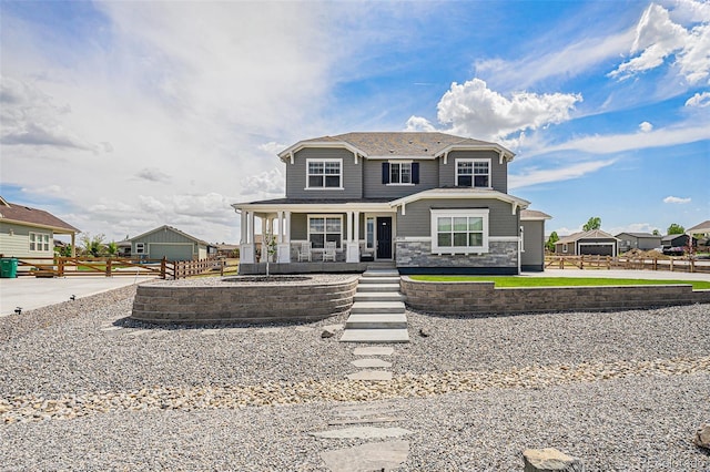 4532 Dewey Ln, Brighton, CO 80603 - view of front facade featuring a porch and stone siding