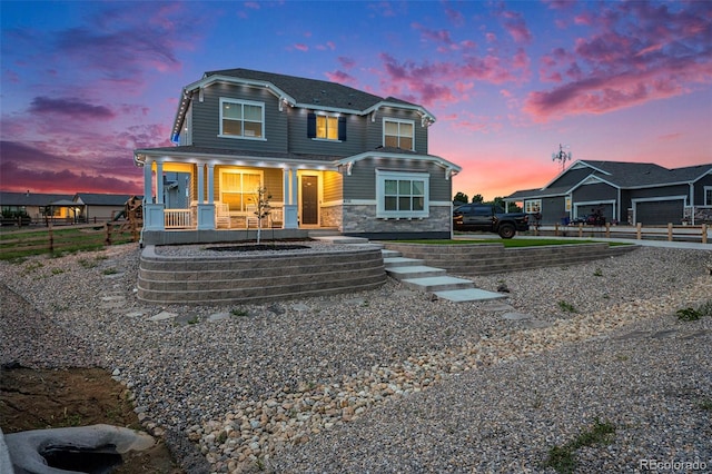 4532 Dewey Ln, Brighton, CO 80603 - view of front facade with stone siding and a porch
