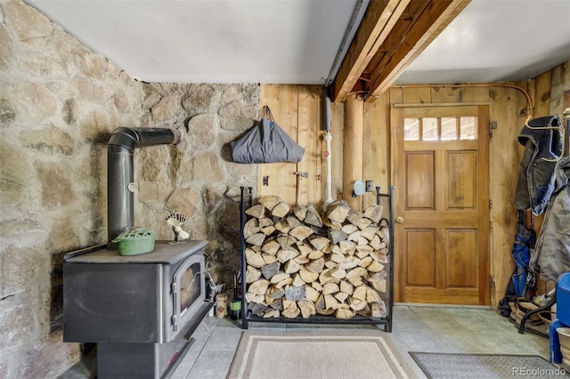 351 Badger Cir, Guffey, CO 80820 - tiled entryway with a wood stove and wood walls