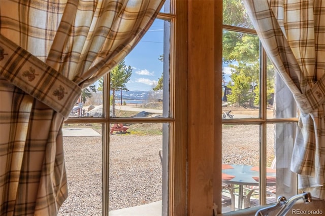 1348 Gcr 64, Grand Lake, CO 80447 - doorway to outside featuring a wall of windows