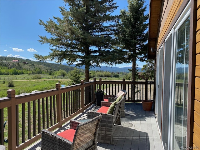 1348 Gcr 64, Grand Lake, CO 80447 - wooden terrace with a mountain view and a view of rural / pastoral area