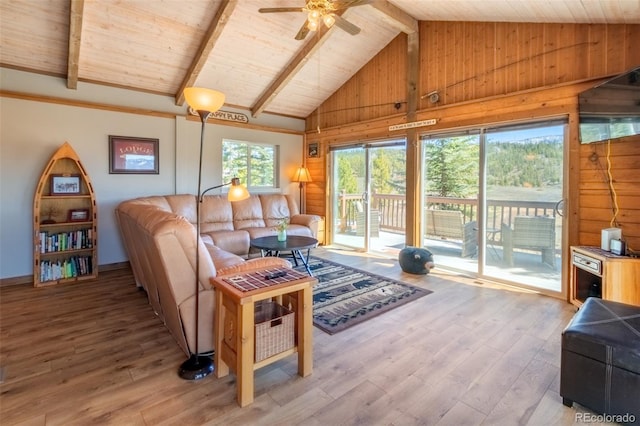 1348 Gcr 64, Grand Lake, CO 80447 - living area with ceiling fan, light wood-style floors, wood walls, beamed ceiling, and high vaulted ceiling