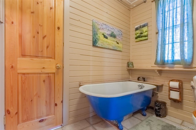 1348 Gcr 64, Grand Lake, CO 80447 - full bath with wood walls, a freestanding bath, tile patterned flooring, and plenty of natural light