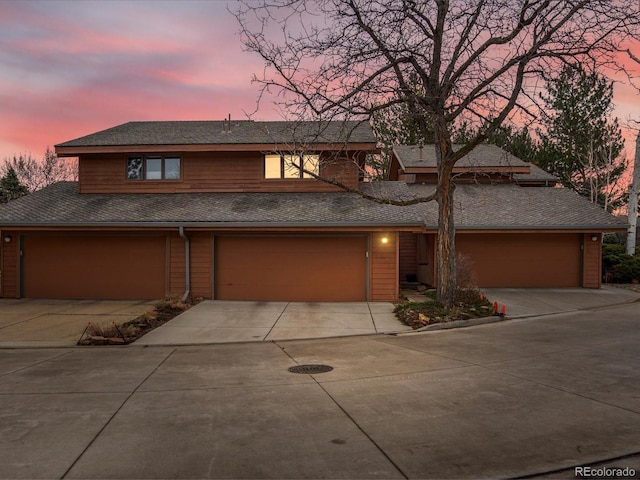 view of front facade with driveway and an attached garage