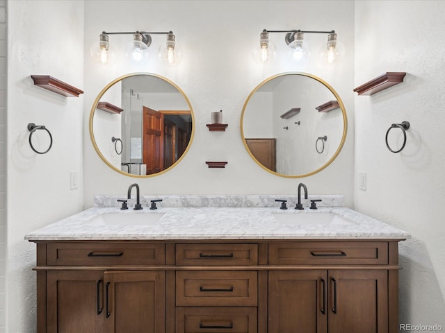 full bathroom with double vanity and a sink