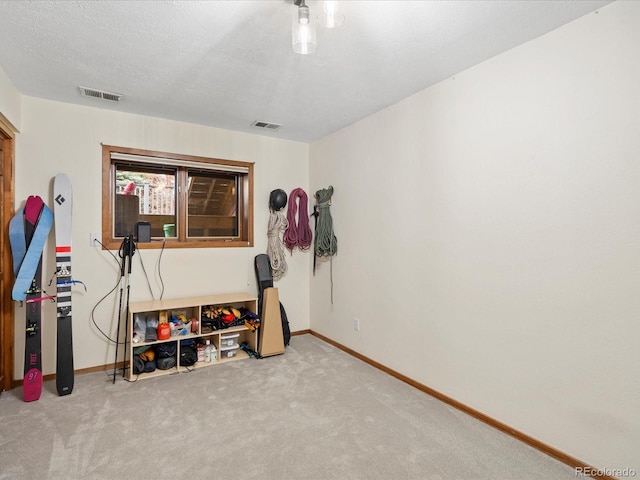 game room with carpet floors, visible vents, and baseboards