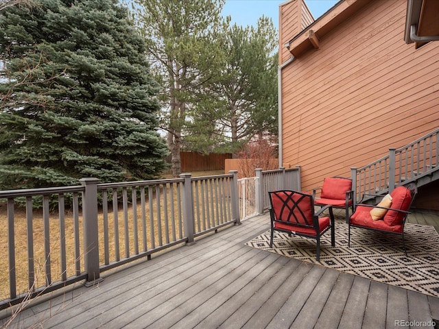 wooden terrace featuring fence